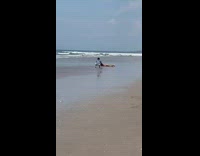 Woman bikini lay on stomach beach photographer