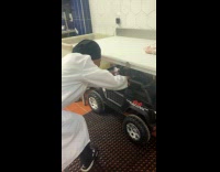 Man comes to work using rechargeable toy car 