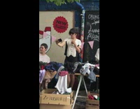 Black white shirt guy holds drink selfie 