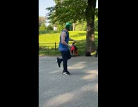 Guy wearing red green wrestling mask dances 