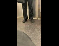 Person wearing toe shoes on subway train