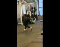 Woman green yoga pants stretch legs gym