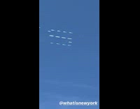 Skywriting in progress salute essential black lampposts 