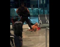 Collab IITW - Man dances near woman on airport ground