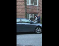 Blue jacket guy sings loudly into phone 