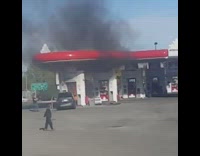 Gas station fire guy tries to break through window