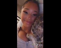 Man annoyed that the dog is in their bed