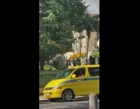 Woman red dress placed phone garbage bin park