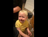 Little boy yellow shirt gets finger in mouth 