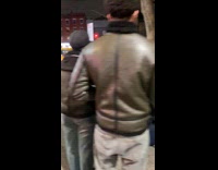 Group pray over homeless man kneel on ground