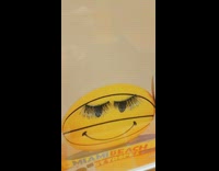 False lashes on smiley face advertisement