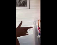 Girl switches different hand symbols to music 