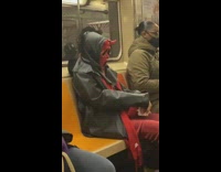 Person in red devil scream costume