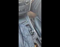 Friend takes off cover of shift stick while friend is driving