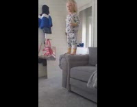 Little girl jump off sofa hits butt and flies forward
