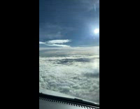 Time lapse plane fly over cloudy sky