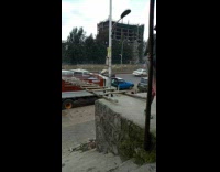 Workers load cement walk ladder to truck