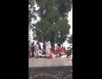 Woman dances on photo booth that rotates