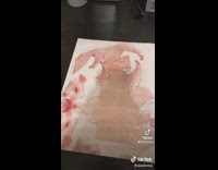 Girl puts together origami printed pig