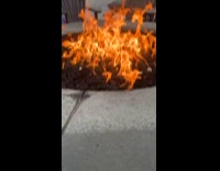 Woman on a trance staring at fire 