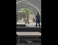 Two women teach each other poses AT&T