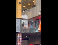 Three people tiktok dance mall upper floor