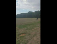 Black shirt older guy dances alone grass