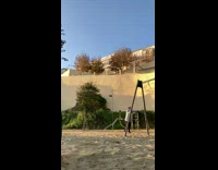 Guy on bungee swing does front flip 