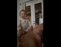 Baby talking to parents