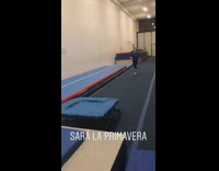 Girl jumps off trampoline,  does a front flip, and scorpions onto blue mat