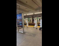Group of women handmaid costume frolic at subway