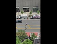 2 people set up upside-down side on road 