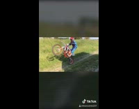 Red motorbike drifts on dirt road Pt. 2