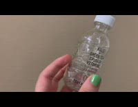 Collab DailyDoseOfInternet - Girl hold empty bottle filled with bubbles