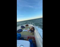 Woman on deck thrown by strong wave