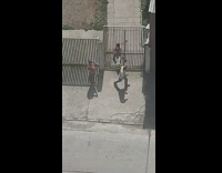 Man reflective vest dance street near gate