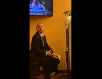 Collab FunBestVids - Guy black suit sits chair shakes bottle 