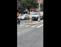 Collab WINY - Woman takes pictures of man while crossing