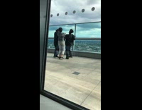 Three girls tiktok dance glass balcony railing 