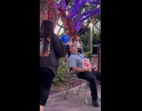 Woman selfie with asleep man at park