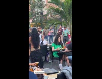 Woman performs sword dancing at outdoor dining