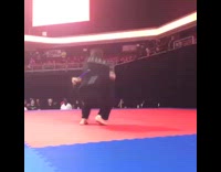 Guy black karate uniform spinning nunchucks backflip fail