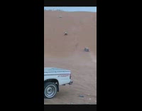 Car on sand on fire taken out by other car