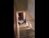 Guy with long curly hair nose dives down stairs