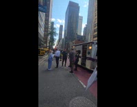 Firefighters and cops around taxi accident street