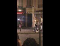 Four women uses flashlights for a tiktok video