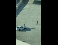 Man sit on white car parking rooftop