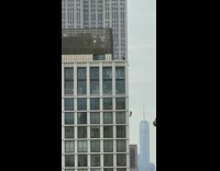 Window washer being lowered side of building