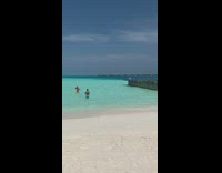 Man bright orange shorts beach