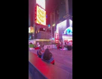 Woman twerks on street light stoplight